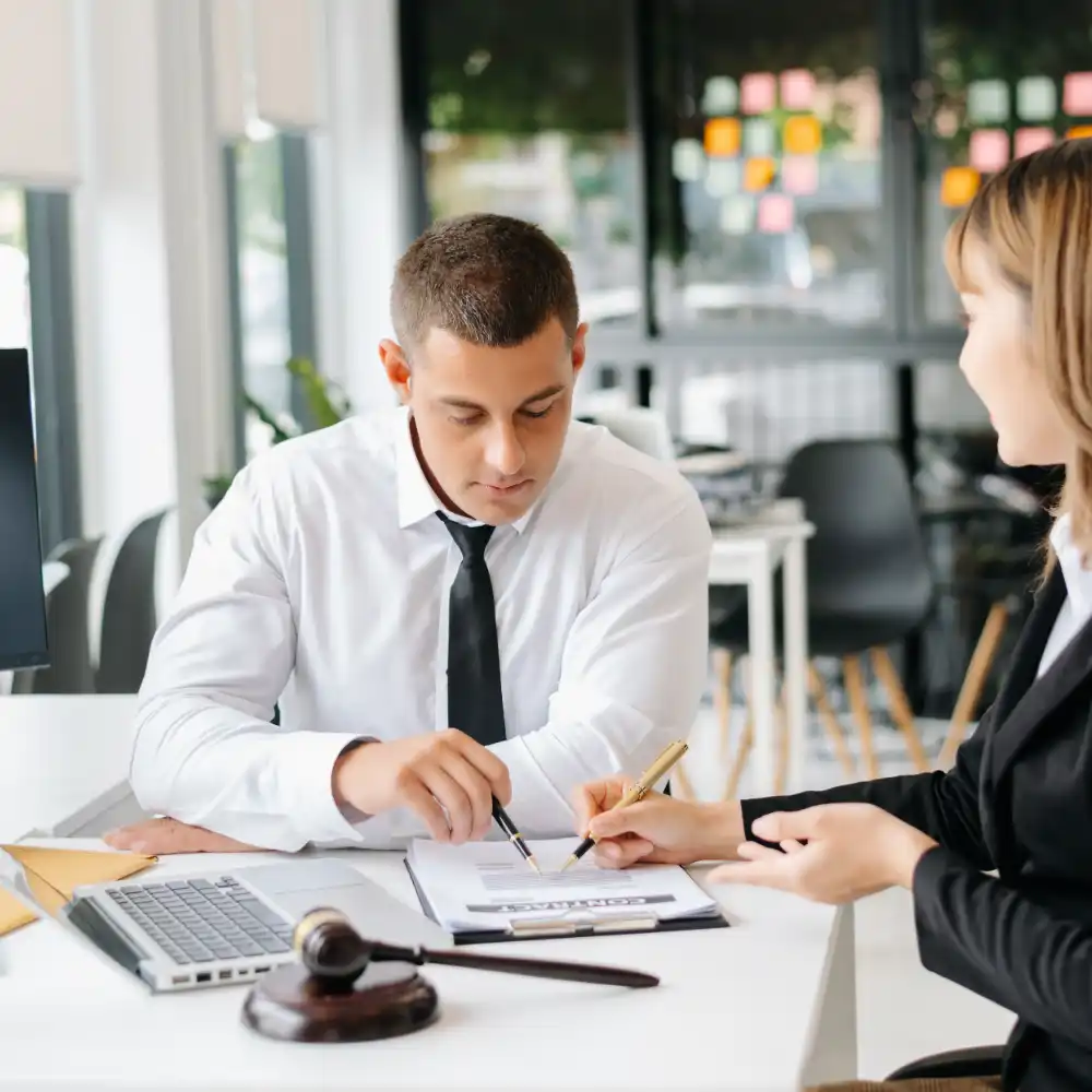 Legal professionals reviewing a contract together